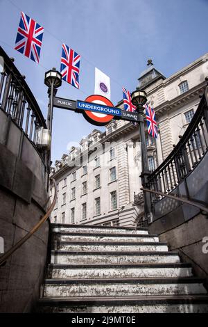 Bunting for the Queen`s Platinum Jubilee seen above Piccadilly  underground station in London, taken 21st May 2022. Stock Photo